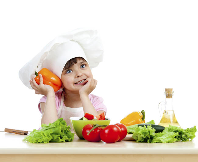 Chef girl preparing healthy food vegetable salad over white back